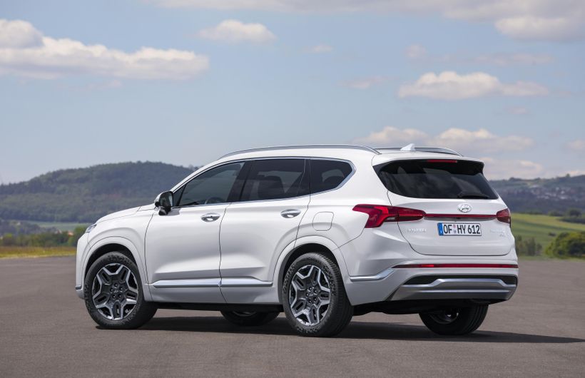 White Hyundai Santa Fe left side and rear 